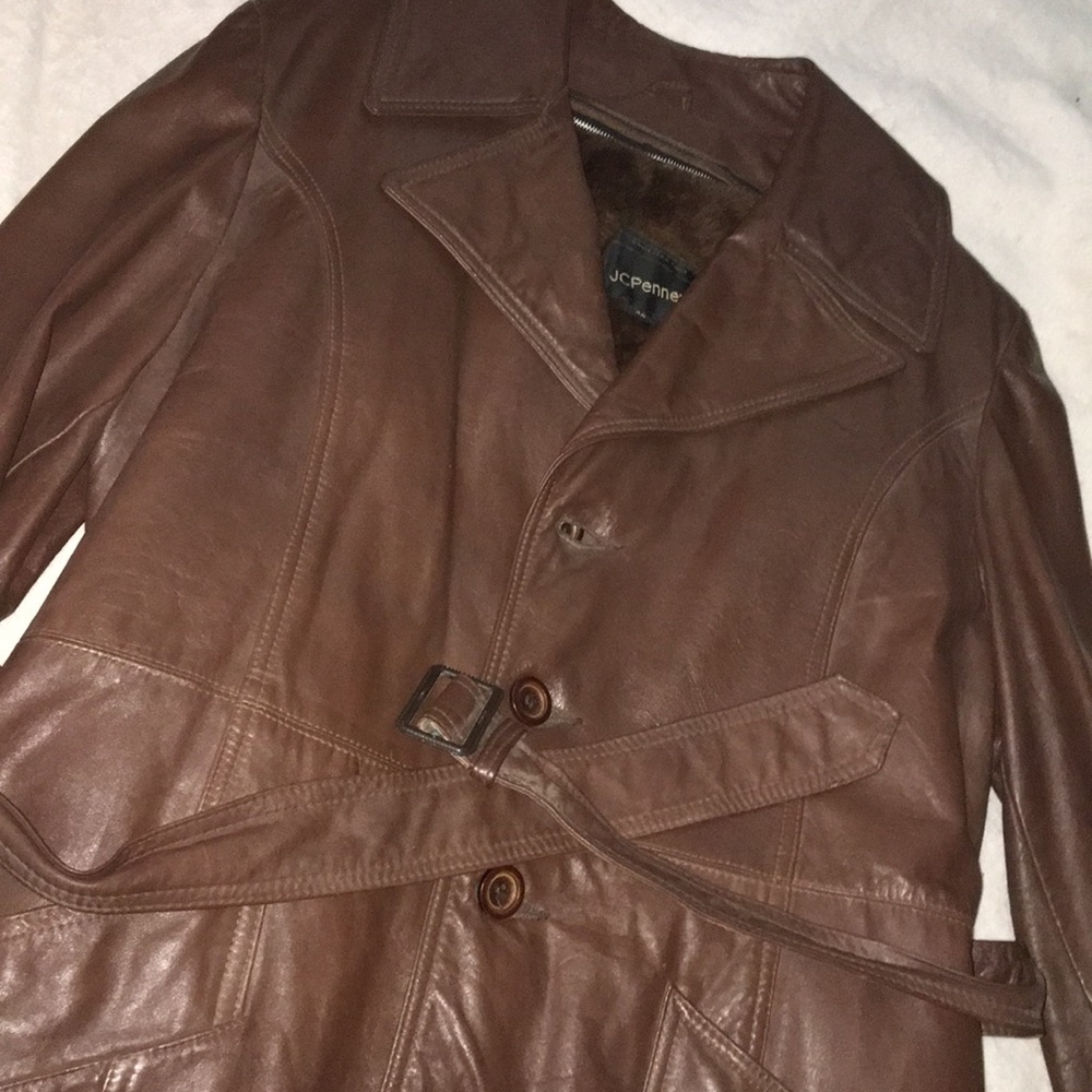 Size 42 brown men’s dress coat with fur lining.